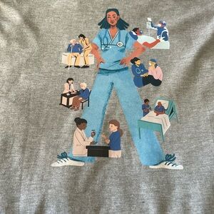 Brand new. Long sleeve T shirt. Healthcare/ Nursing. Size M. Color Grey